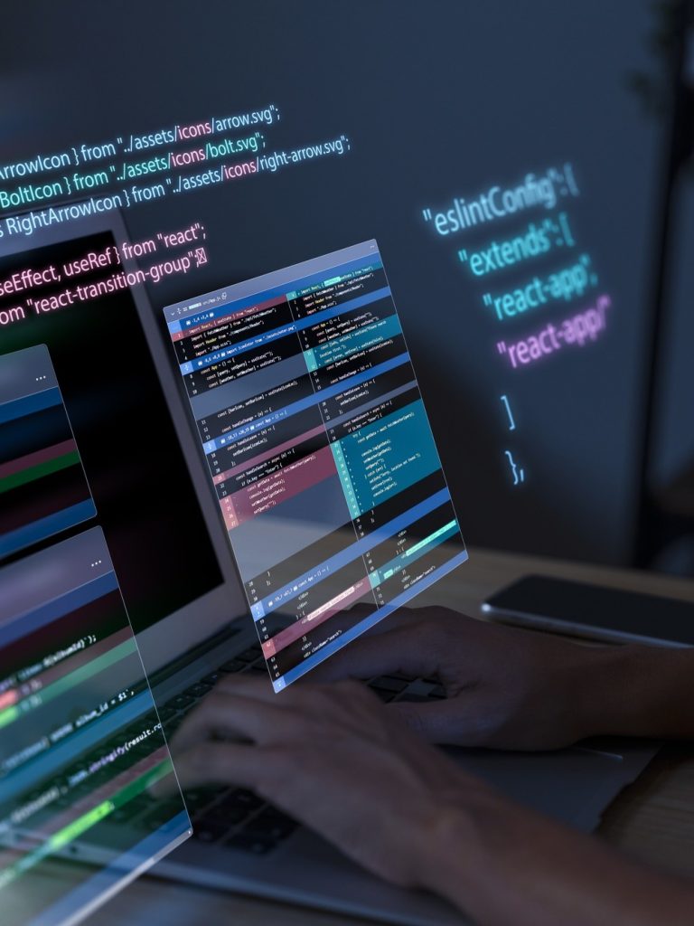 programming-background-with-person-working-with-codes-computer