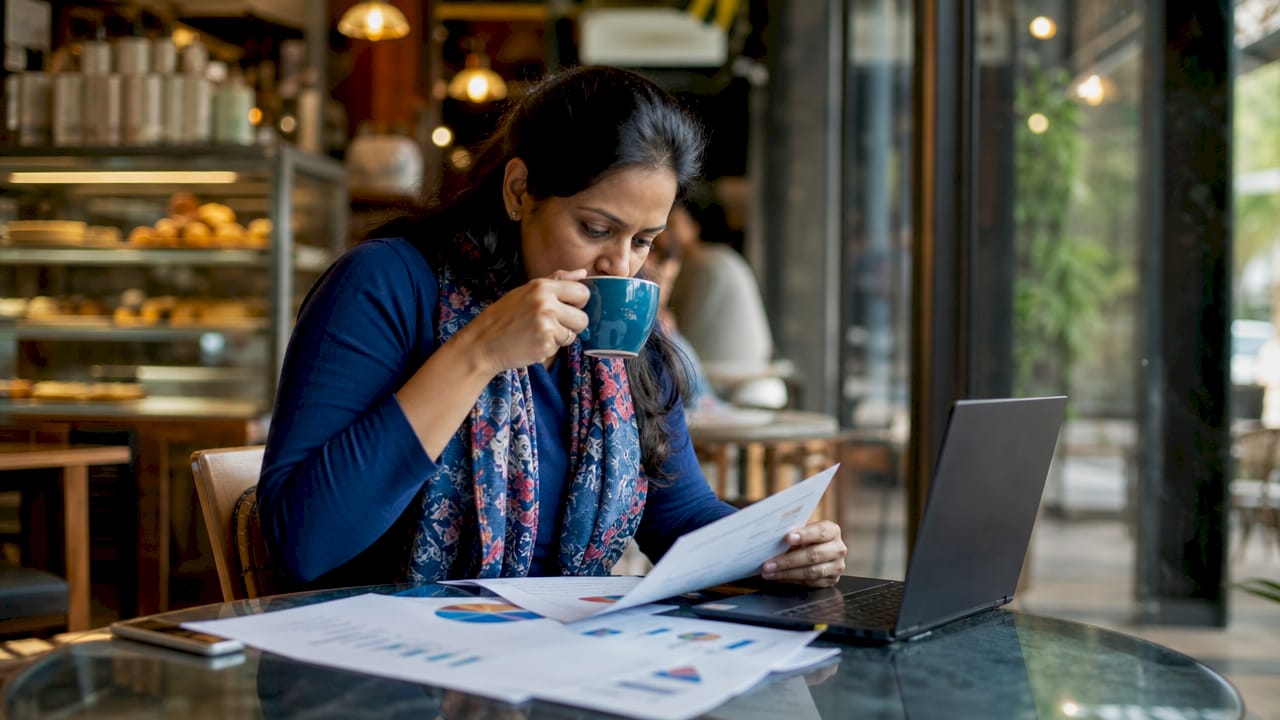 Woman reviewing marketing strategies at conference table